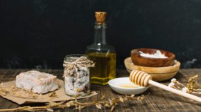 organic-soap-bar-with-ingredients-dark-background