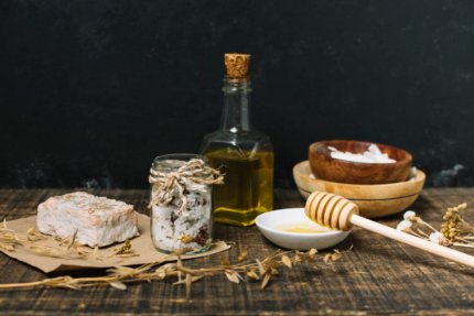 organic-soap-bar-with-ingredients-dark-background