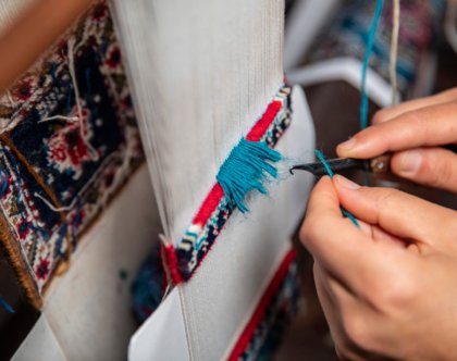 Knitting carpet with blue threads. High quality photo